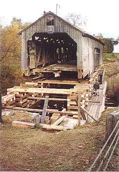 Brown's River Bridge being removed from the river